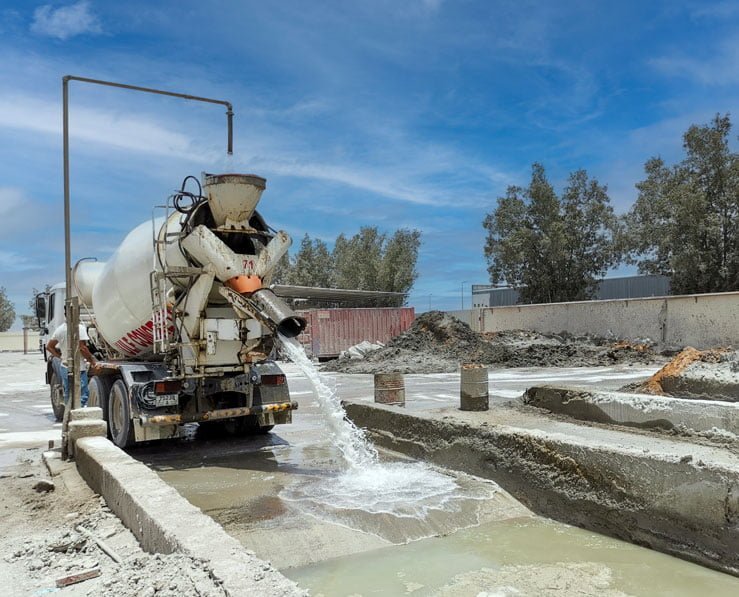 Concrete Mixer unloading wastewater to raw water pit